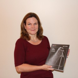 Methven's new Sales Manager Rachael Gray, holding its One Book brochure